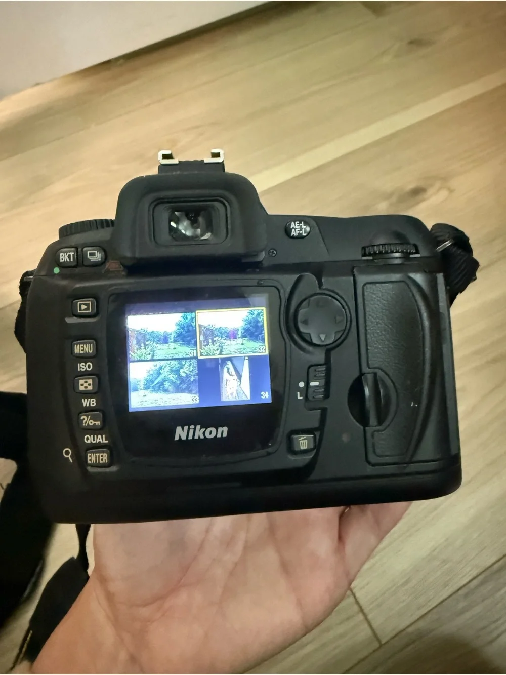 Nikon DSLR Camera in Black with Attached Lens